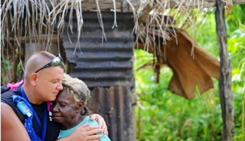 Man giving a woman a hug